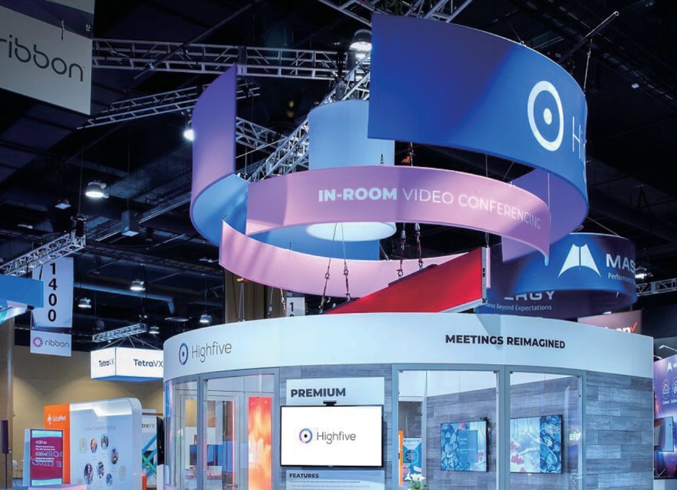 Hanging banners suspended above trade show booths