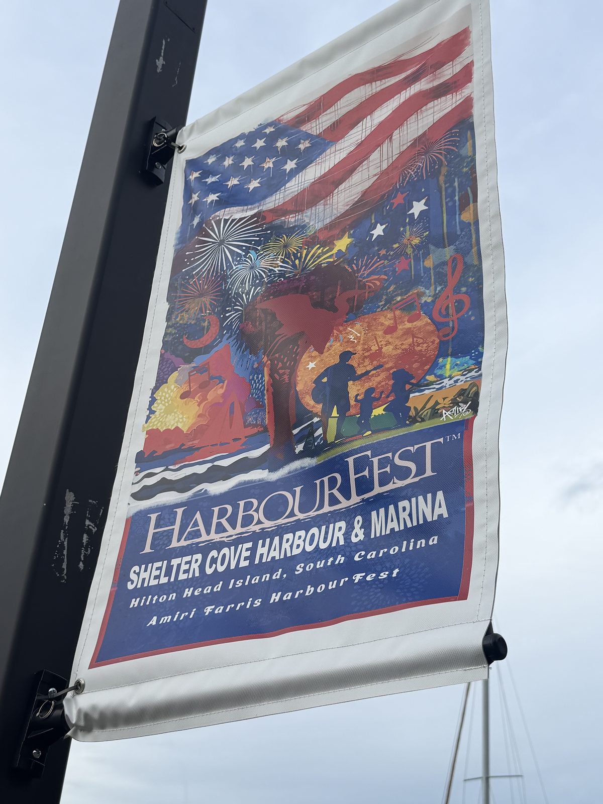 Custom printed street pole banner for Harbour Fest mounted on a light pole